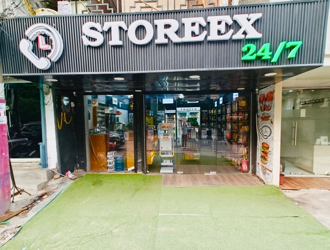 Storeex 24/7 storefront entrance with signage