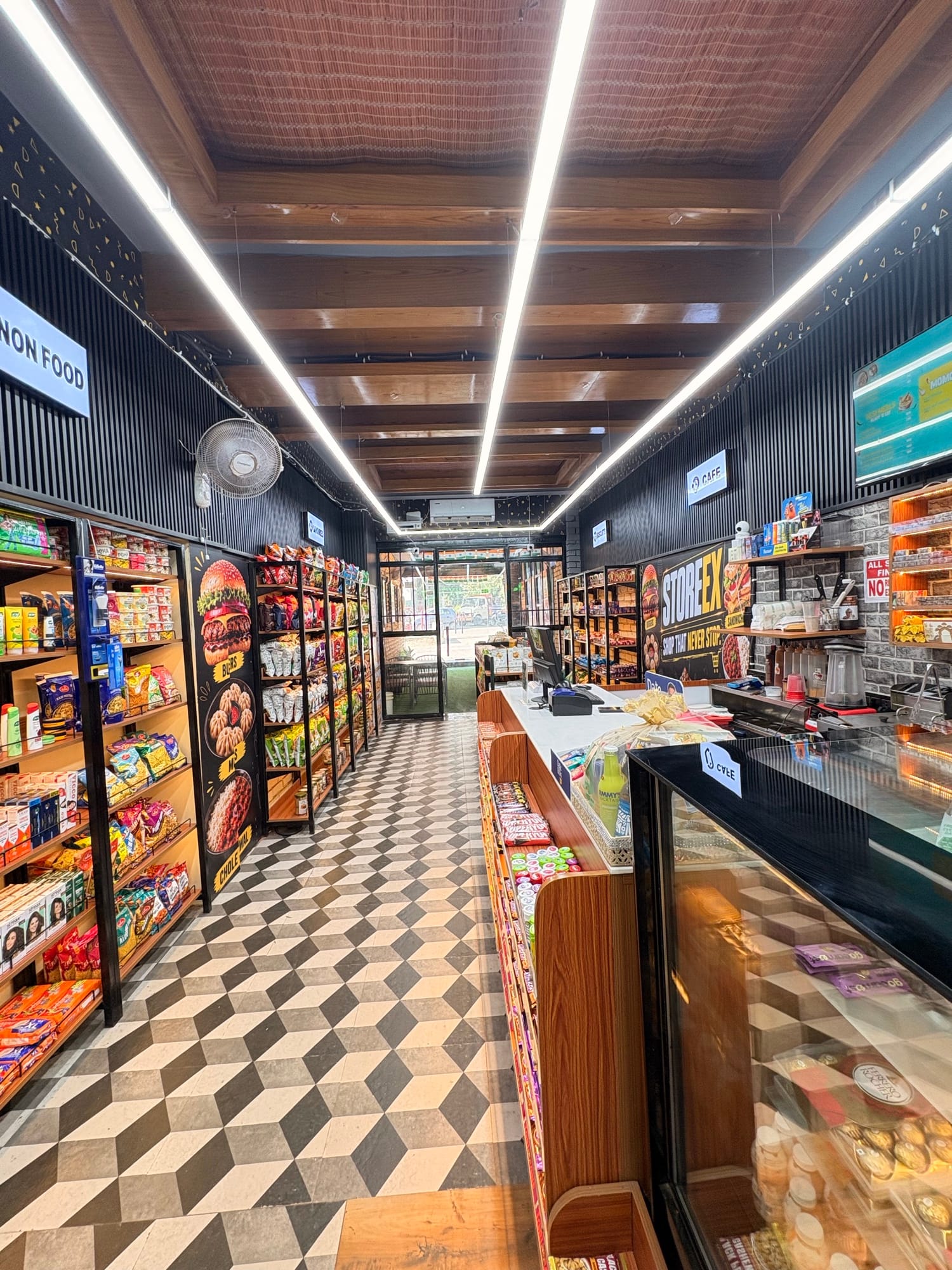 Café counter and snack aisle inside a Storeex outlet